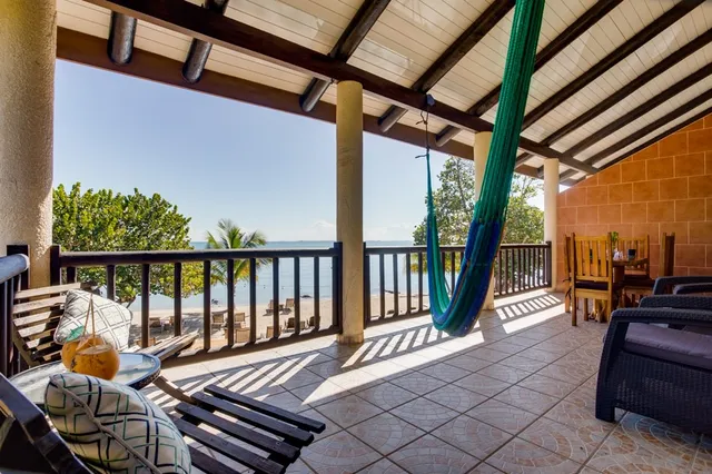 A suite balcony with hammock over the water